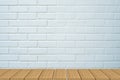 Empty table in front of white brick background.