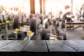 Empty table montage with blur fitness gym room on background