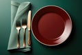 Empty table plate setting on green background.