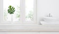 Empty table for product display against defocused bathroom window background Royalty Free Stock Photo