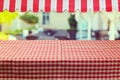 Empty table with red checked tablecloth and awing Royalty Free Stock Photo
