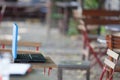 empty table seat in coffee shop with notepad on table