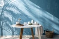 Empty table on smooth blue wall background Royalty Free Stock Photo