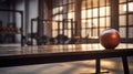 An empty table stands with a disciplined grace, fitness from the energetic surroundings of a blurred Gym