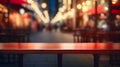 An empty table stands gracefully, capturing the ambient lights of a vibrant, blurred Shop background, ready for product display Royalty Free Stock Photo