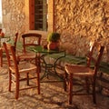 Empty table at an street village restaurant, Crete, Greece Royalty Free Stock Photo