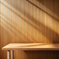 Empty table on bright brown wall background with strip shadows on the wall and wooden desk. Mock up for presentation, branding Royalty Free Stock Photo
