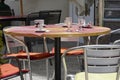 Empty table in a terrace cafÃÂ© with cups and glasses on it.