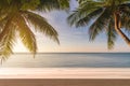 Empty table top with coconut palm tree and blue sky at tropical beach, Summer vacation concept Royalty Free Stock Photo
