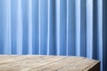 Empty table top with office blue blinds for montage your product Royalty Free Stock Photo