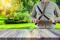 Gardener holding a hedgecutter blurred in the background. Gardening concept Royalty Free Stock Photo