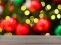 The empty table wooden board in front of the background is blurred. Perspective of brown wood in the light of a christmas tree Royalty Free Stock Photo