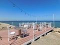 empty tables in a cafe on the beach. Larnaca. Cyprus Royalty Free Stock Photo