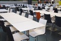 Empty tables and chairs in the fast food areea