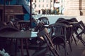 Empty tables and chairs near the closed street cafe Royalty Free Stock Photo