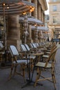 Empty tables and chairs of a parisian bar at the Palais Royal place in Paris