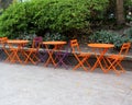 Empty tables and chairs in a street cafe Royalty Free Stock Photo