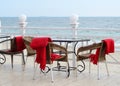 Empty tables at hotel restaraunt with red plaids on the beach