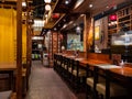 Empty tables with no customers at The Public Izakaya Japanese restaurant in Tanjong Pagar, Singapore in the evening. Business has