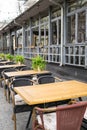 Empty tables in street cafe, chairs in street reastaurant Royalty Free Stock Photo