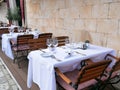 Empty tables of street cafe during lockdown, coronavirus quarantine, Cafe Terrace in old town, outdoor patio chair and table in Royalty Free Stock Photo