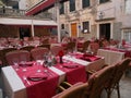 Empty tables of street cafe during lockdown, coronavirus quarantine, Cafe Terrace in old town, outdoor patio chair and table in Royalty Free Stock Photo