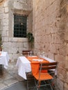 Empty tables of street cafe during lockdown, coronavirus quarantine, Cafe Terrace in old town, outdoor patio chair and table in Royalty Free Stock Photo