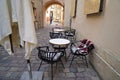 Empty tables of street cafe during lockdown, coronavirus quarantine, Cafe Terrace in old town, outdoor patio chair and table in Royalty Free Stock Photo