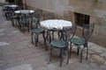 Empty tables of street cafe during lockdown, coronavirus quarantine, Cafe Terrace in old town, outdoor patio chair and table in Royalty Free Stock Photo