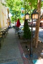 Empty tables of a street cafe on a narrow street of Manassas Royalty Free Stock Photo