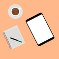 Empty tablet and a cup of coffee on the desk isolated on orange background Royalty Free Stock Photo