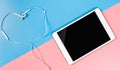 Empty Tablet screen with earphone on blue and pink Royalty Free Stock Photo