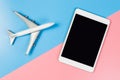 Empty tablet screen with toy plane for travel website Royalty Free Stock Photo