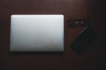 Empty tablet with smartphone and glasses on desk. Business and finance concept. Workplace, Flat lay with blank copy space Royalty Free Stock Photo