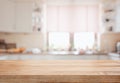 Empty tabletop over defocused kitchen