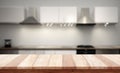 Empty tabletop over defocused kitchen with copy space Royalty Free Stock Photo