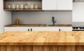 Empty tabletop over defocused kitchen with copy space Royalty Free Stock Photo