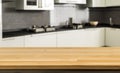 Empty tabletop over defocused kitchen with copy space Royalty Free Stock Photo