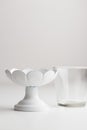 Empty tableware - white cakestand with a clear glass on white background for a dessert Royalty Free Stock Photo