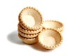 Empty tartlet shells isolated on white. Stacked crispy mini tart shells closeup Royalty Free Stock Photo