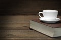 Empty Tea Cup On The Red Old Book In Dark Royalty Free Stock Photo