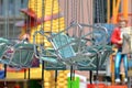 Empty teal blue chairs of chair swing ride at funfair park Royalty Free Stock Photo