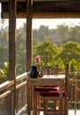 Empty terrace on villa with wooden table and chairs