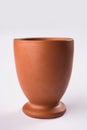 Empty terracotta mug or brown clay coffee cup or jar or drinking glass