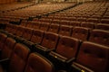 Empty theater or cinema auditorium with padded chairs