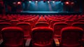 Empty theater with red seats and a lighted stage, performance venue Royalty Free Stock Photo