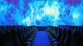 Empty theater seats facing cosmic screen Royalty Free Stock Photo