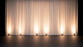 Empty Theater Stage with Lit Curtain and Footlights Royalty Free Stock Photo
