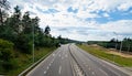 Empty three lane motorway in countryside in evening light Royalty Free Stock Photo