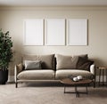 Empty three poster frames on beige wall in living room interior with modern furniture and plant, gray sofa and cozy pillows, 3d